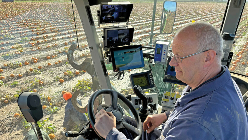 Jez Smith at controls of bespoke pumpkin harvester