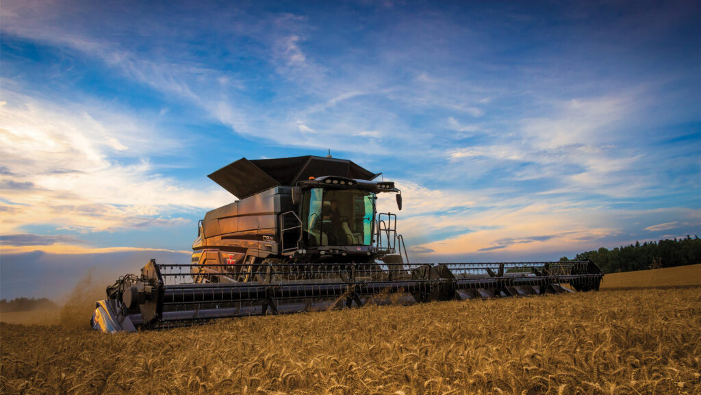 Combine working at sunset