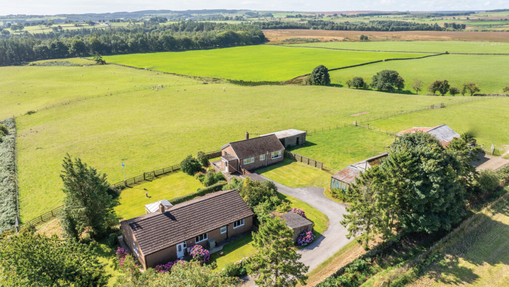 Aerial view of farm buildings and land