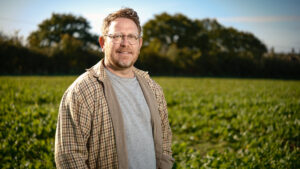 Anthony Becvar in a field