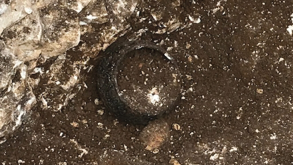 Burnished ware pot uncovered in the soil