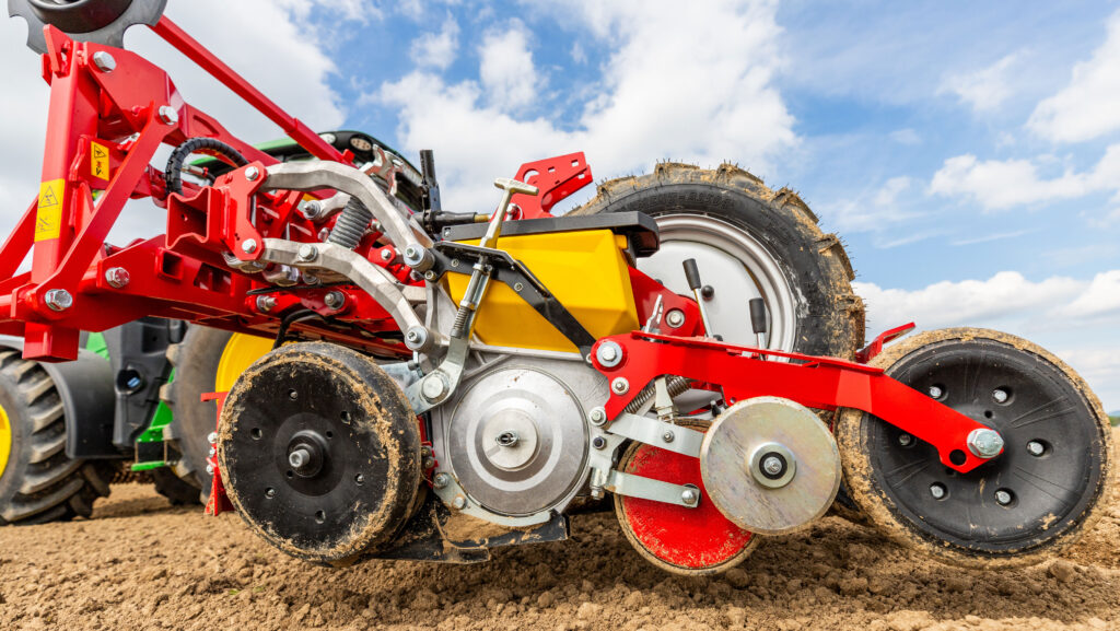 Grimme beet drill working in a field