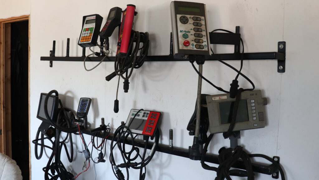 Implement control boxes stored on a rack in the office