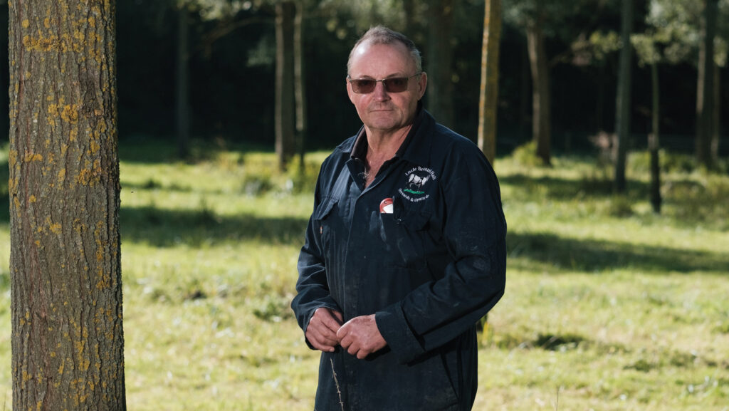 Kit Speakman standing next to a tree