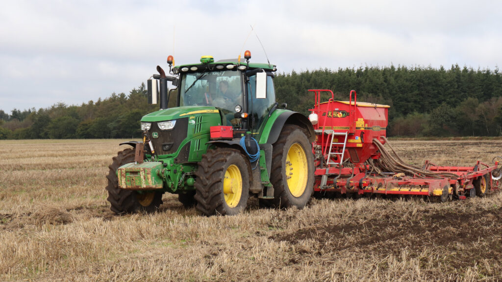 John Deere 6175R with a 6-metre Vaderstad drilling in the field