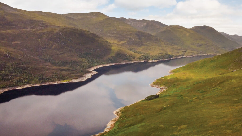 Aerial view of loch and hills