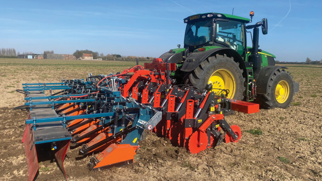 Edwards Farm Machinery 8-row ST strip-till cultivator working in a field