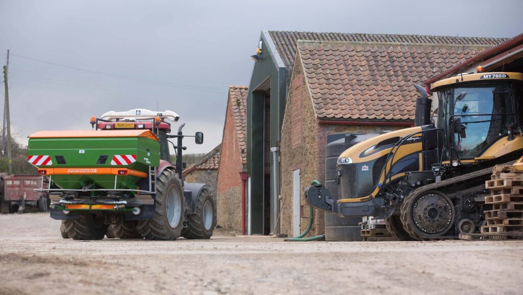 Farmyard with buildings and tractors