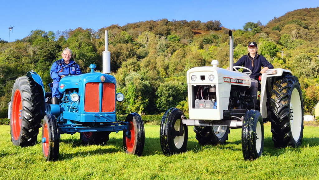 Carolyn and Alex on their tractors