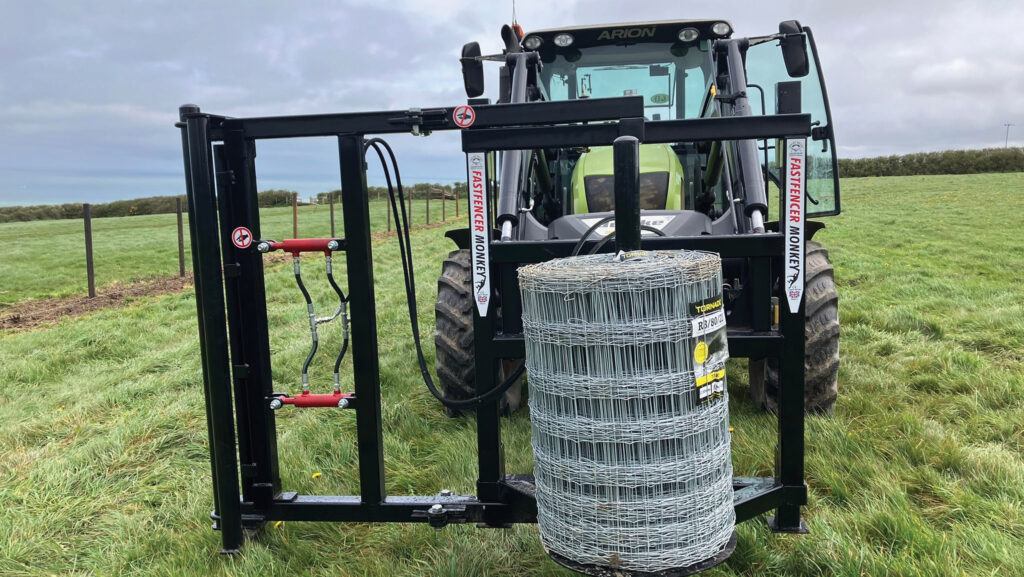 Tractor-mounted frame holding a role of fencing