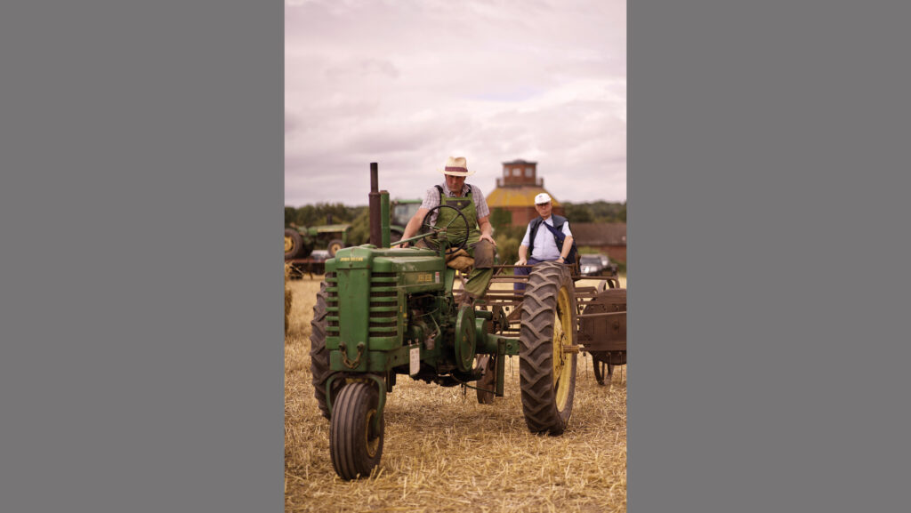 Farmers on vintage tractors