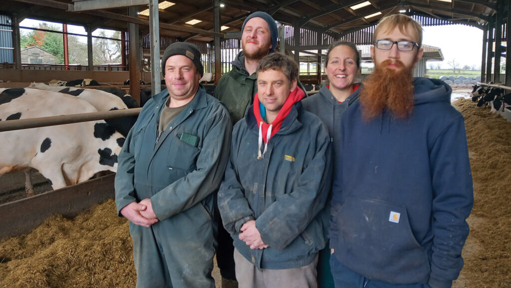 Mark Price, Dave Beckett, Steve Ashley, Ruth Ashley and Alex Gwyther with cows in cow shed