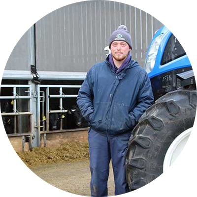 Louis Ford standing next to a tractor