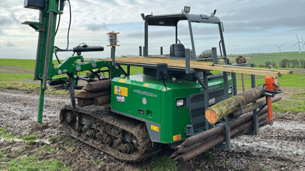 Tracked machine with post drill and fence posts