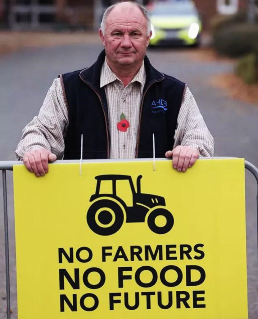 Northumberland farmer Pip Robson with protest placard