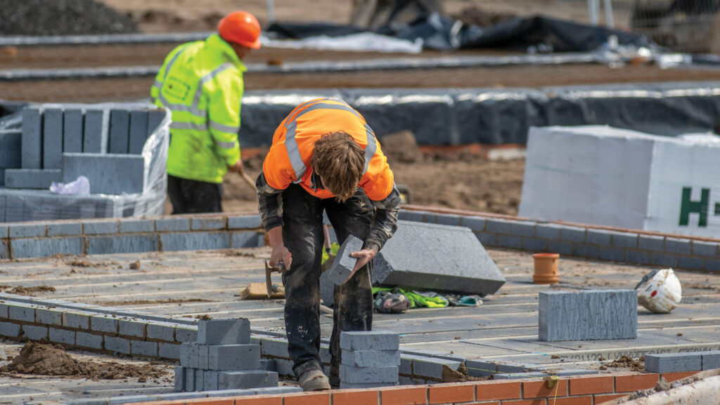 Builders constructing new houses