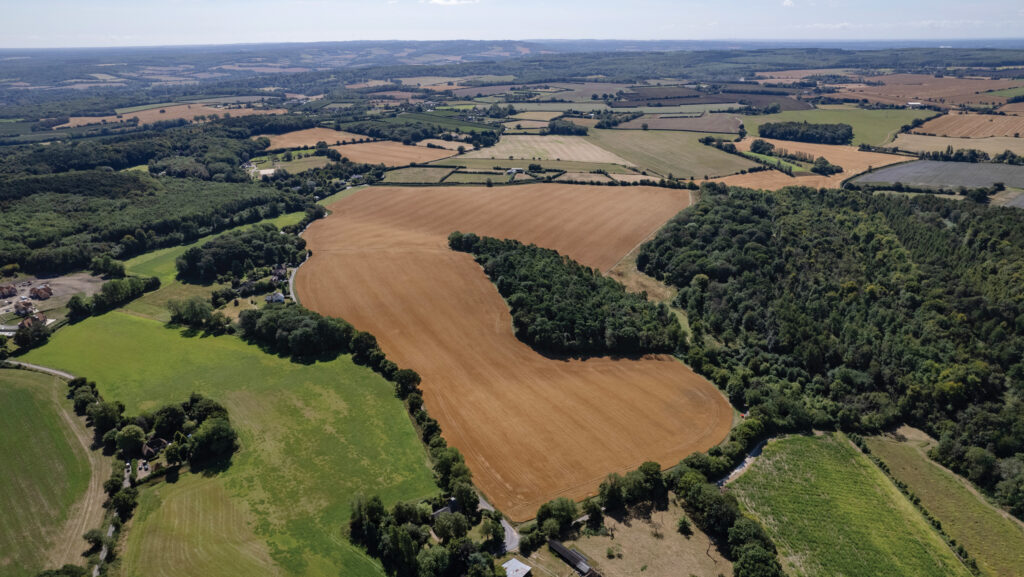 Aerial view of farmland and woodland