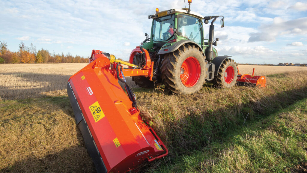 A tractor mowing a dyke