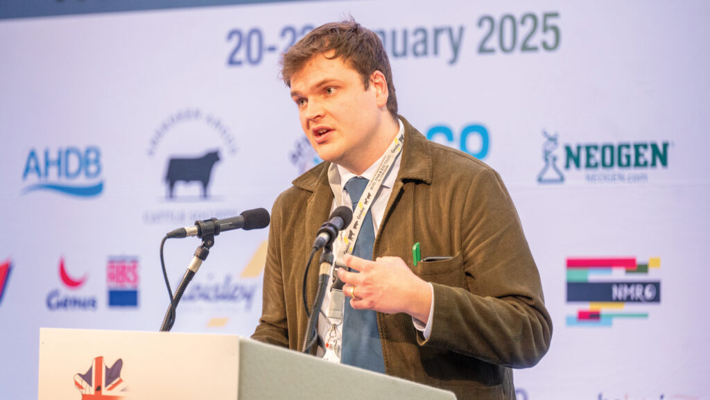 A man speaking at a conference