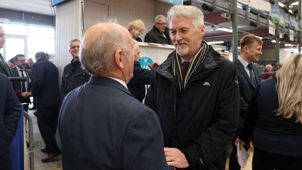 Two men talking at an agricultural show