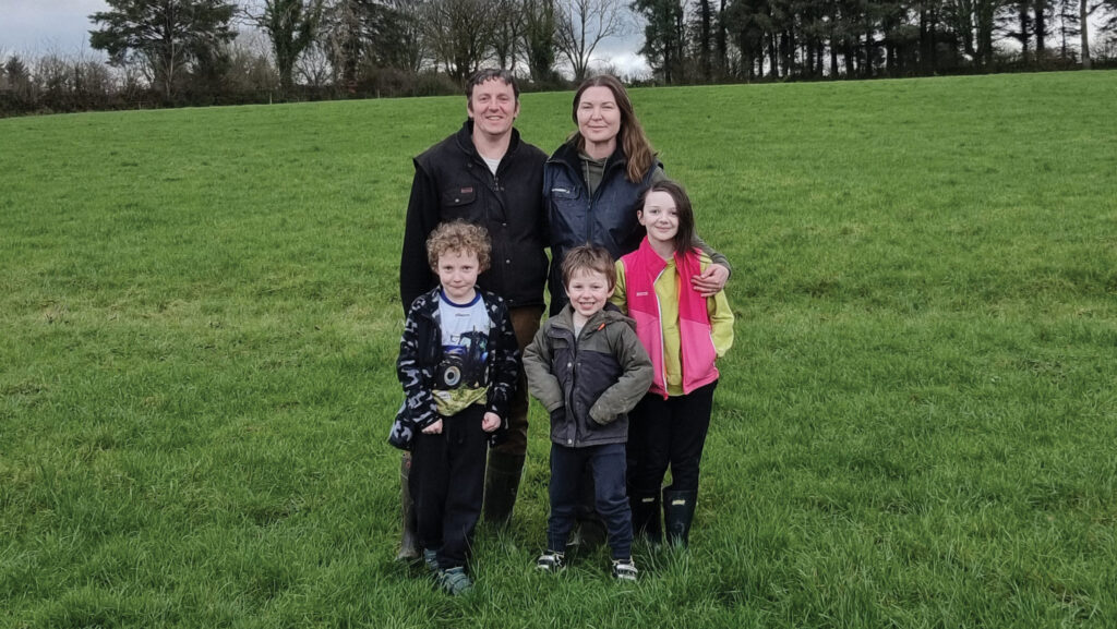 Family group standing outdoors