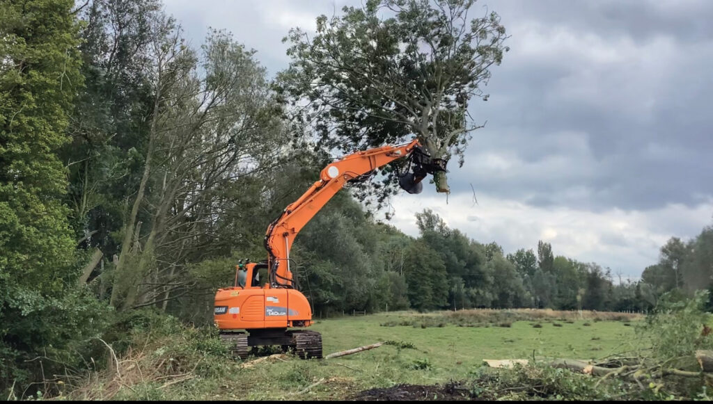 Excavator working in a field