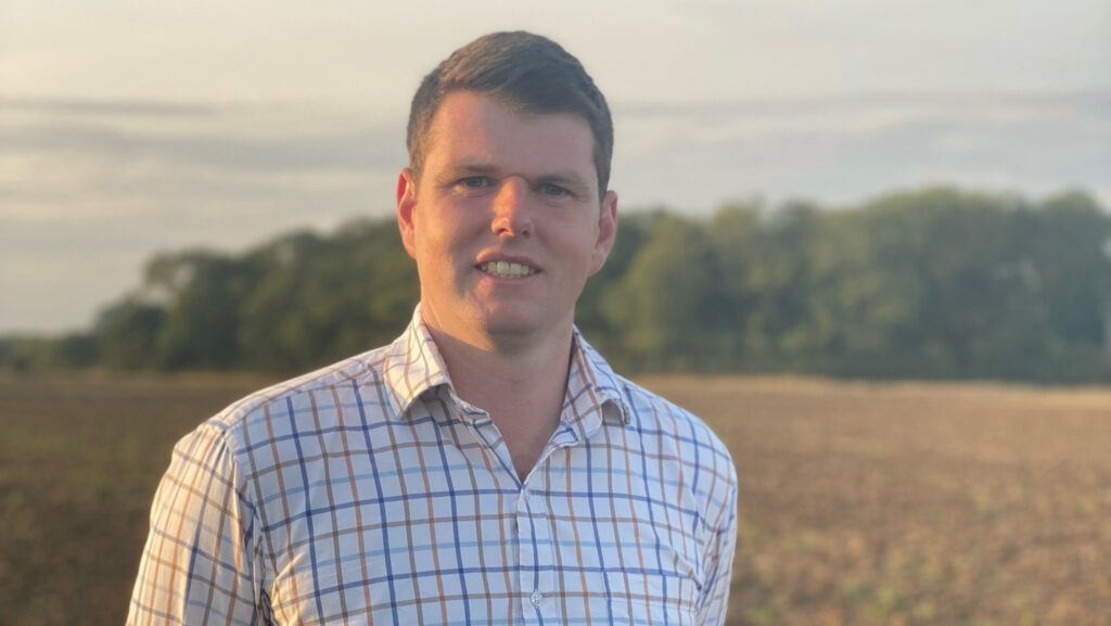 Agronomist George Baxter in field