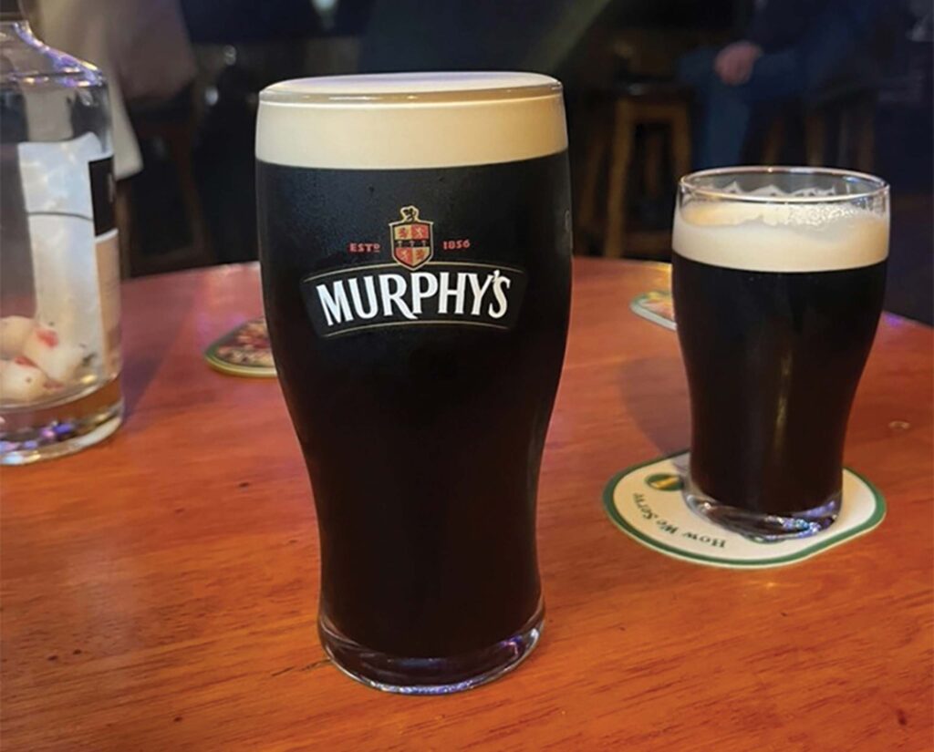 Two glasses of stout beer on a table