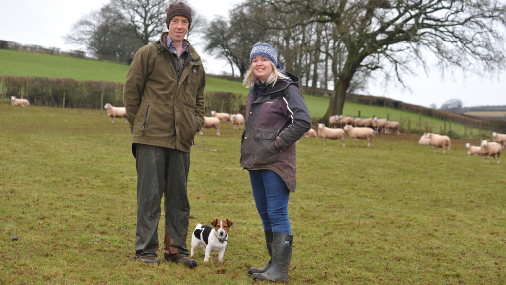 A man and a woman standing in a field