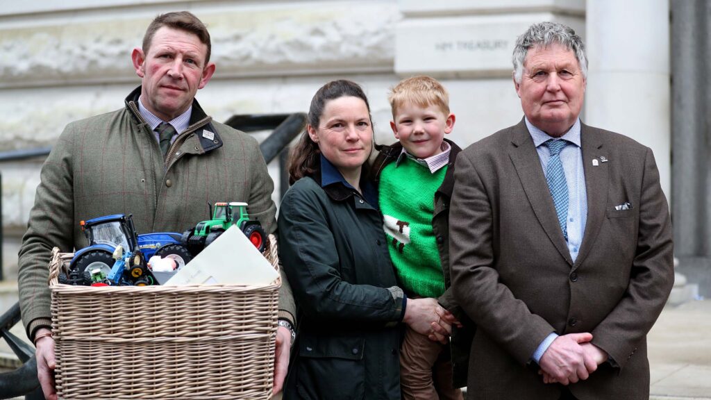 From left: Tom and Hazel Church with  Bertie, 5, and Mrs Church’s father, Martin Towler © NFU