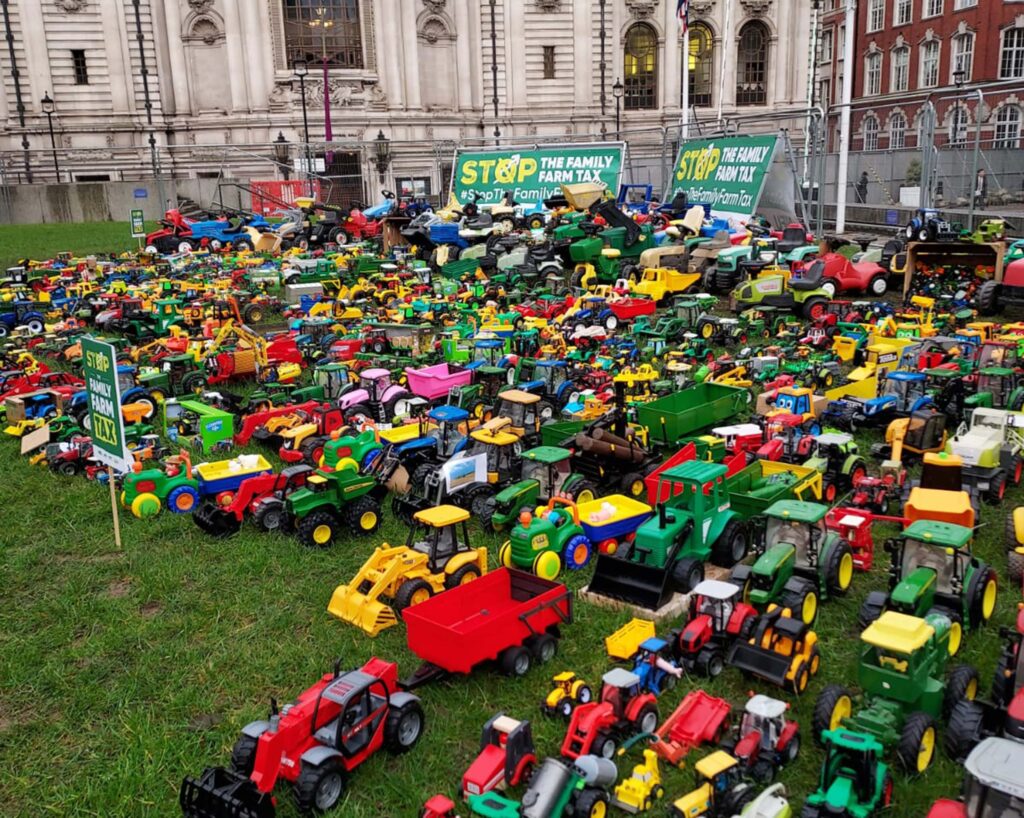 Hundreds of to tractors laid out on a lawn