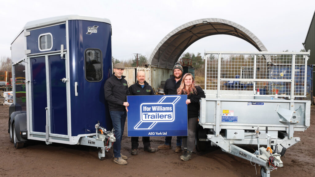 Group of people with horse box and trailer