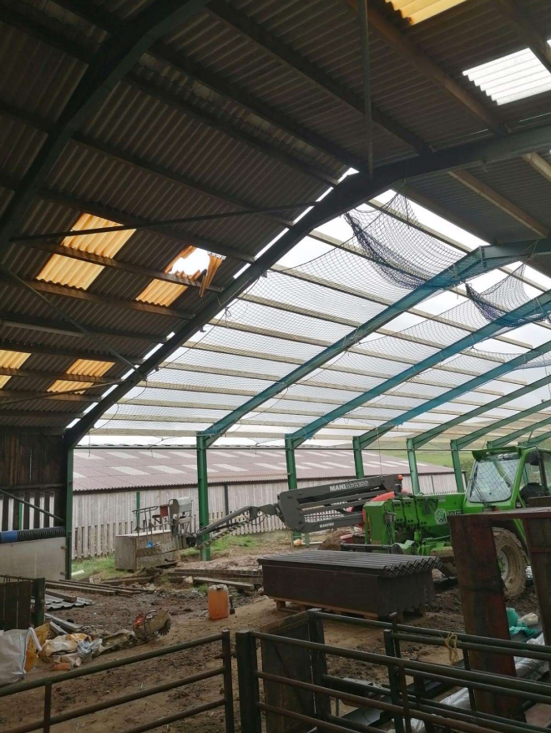 Broken rooflight of sheep shed after worker fell through it