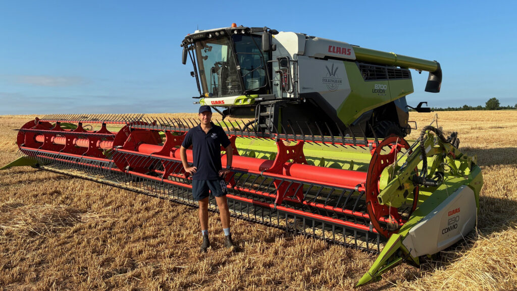 Harry Fountaine in front of combine at Folkingham Farms