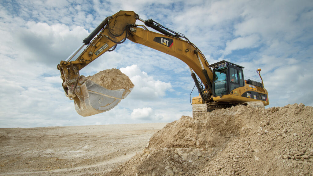 Digger removing soil from a new reservoir build