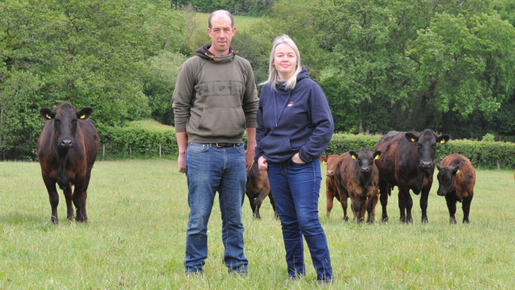 Roger and Dyddanwy-Pugh with herd in the background