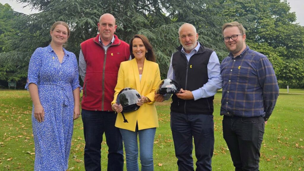 Group of people posing for a picture outdoors