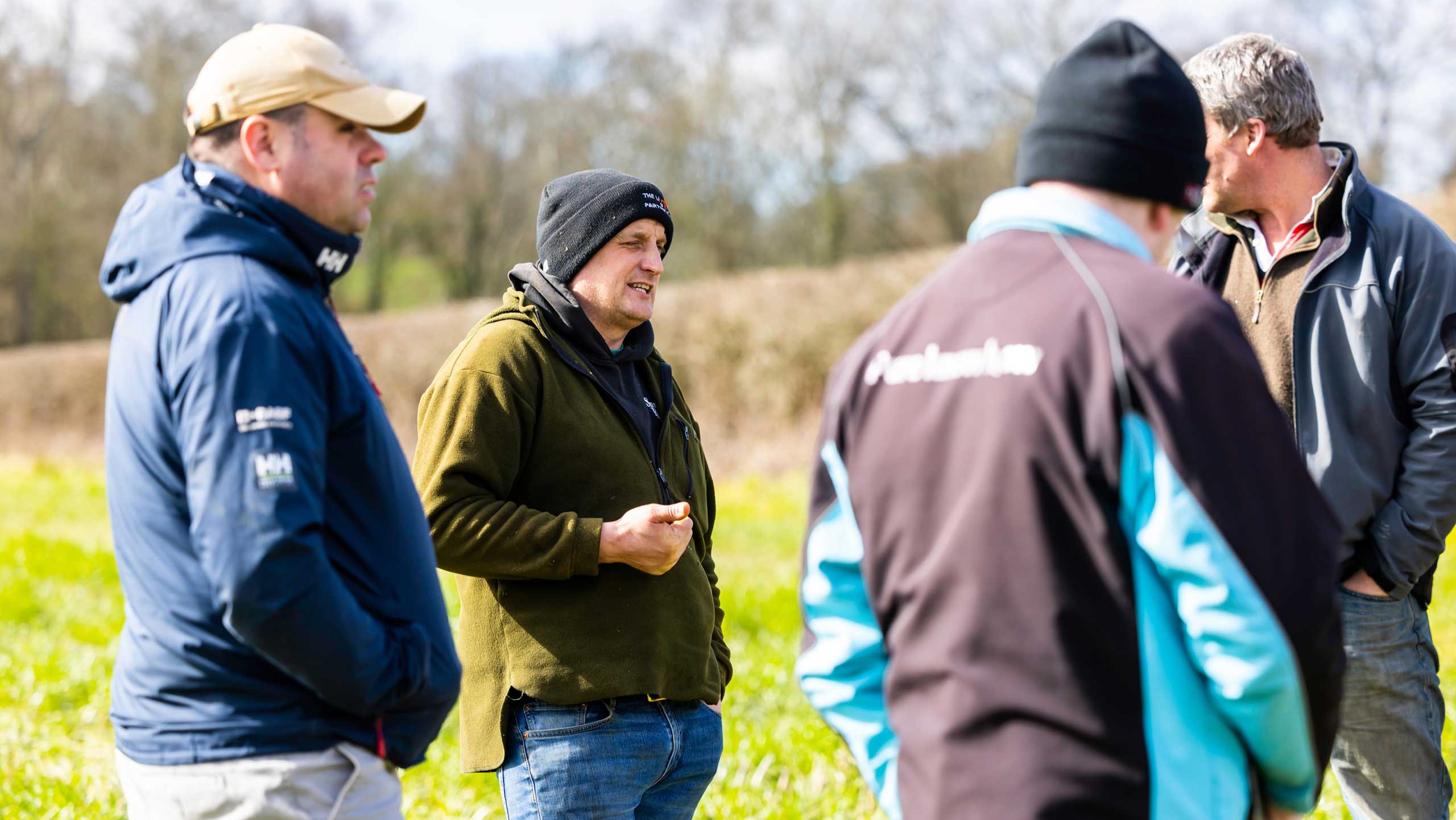 Farmers talking in field