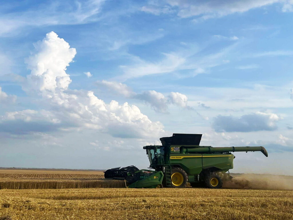 John Deere harvesting wheat in US