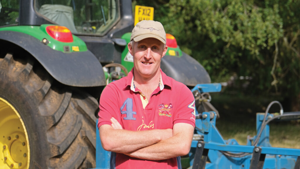 Farmer in front of tractor