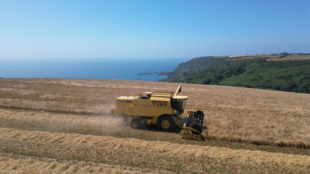 Combine at work with the ocean in the distance