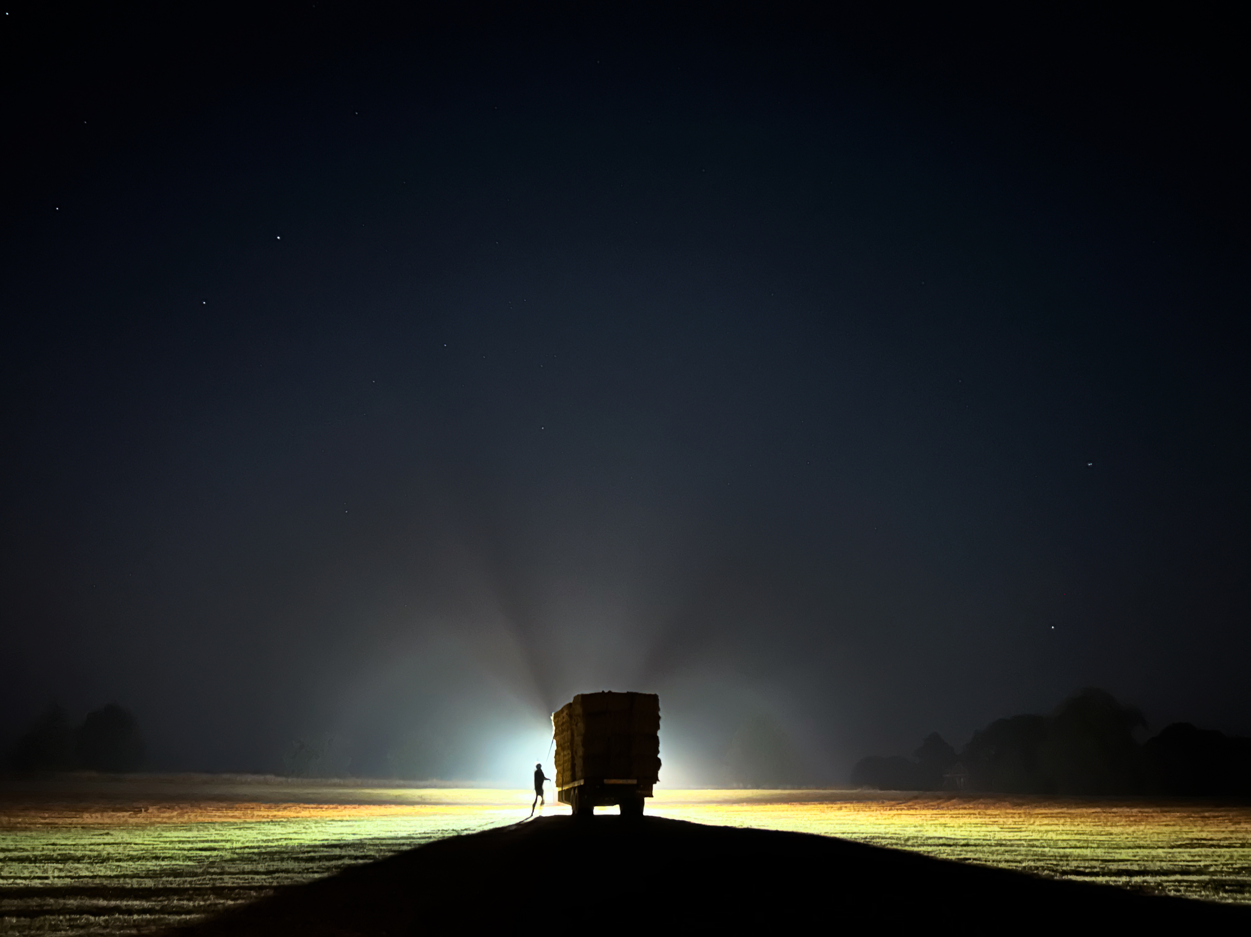 Hay cart at nightfall