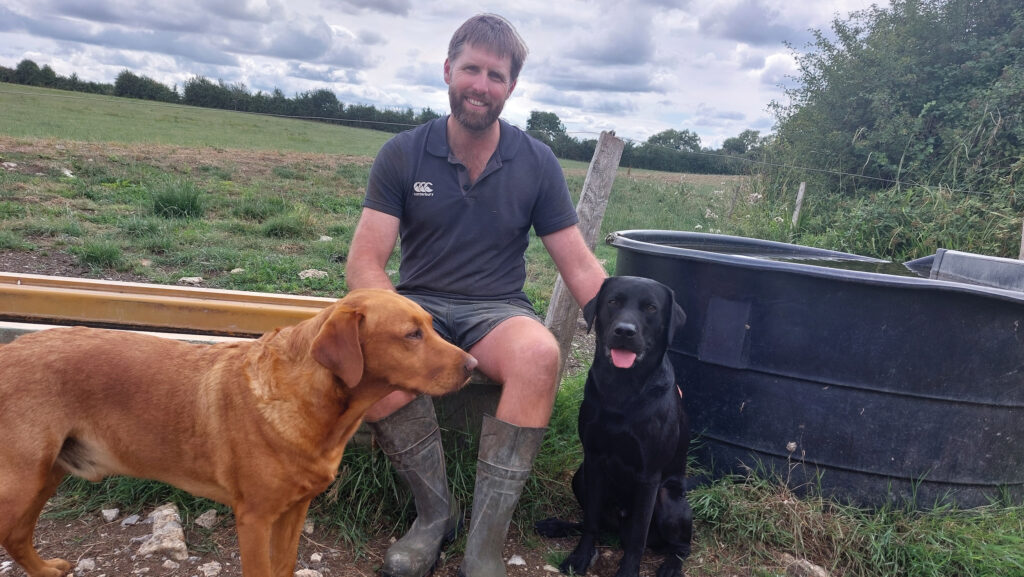 Luke Williamson with farm dogs