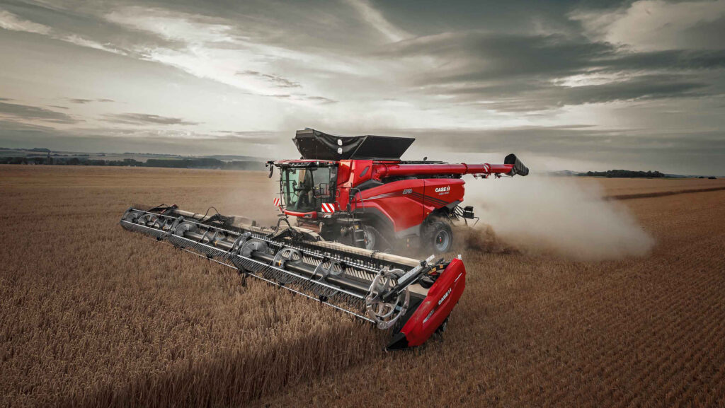 Combine in a field with grey skies