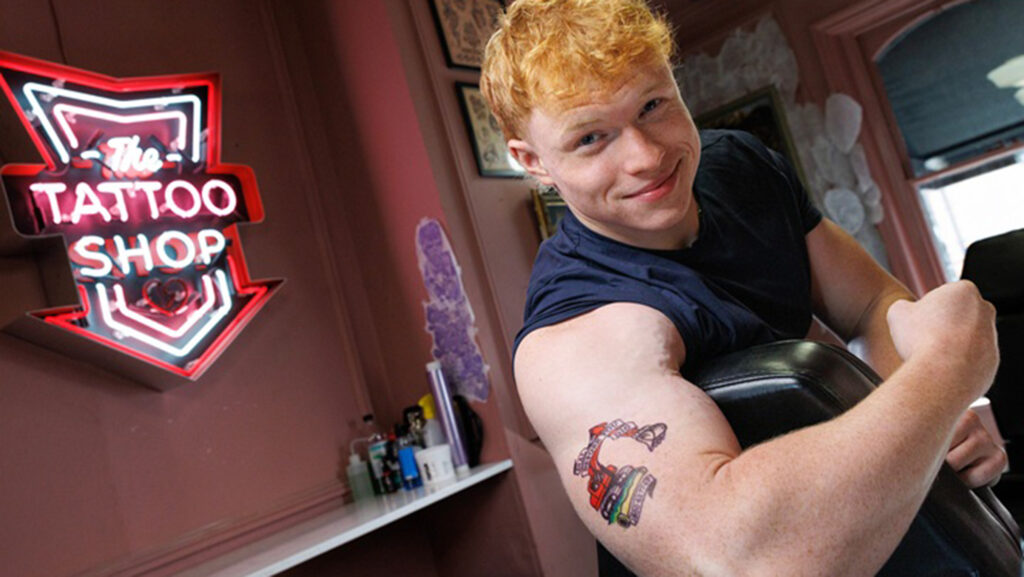 James Doyle in tattoo shop