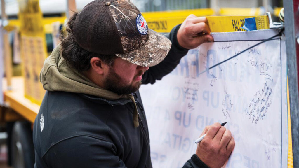 FTA chairman Justin Rogers signed the Trailer of Truth © Farmers To Action