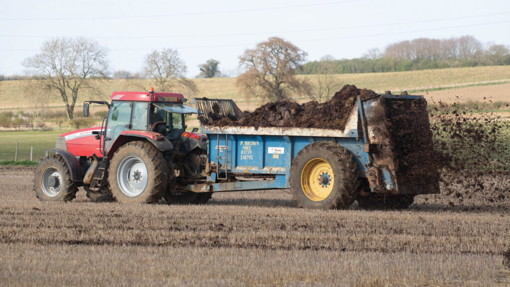 Loading and spreading farmyard manure