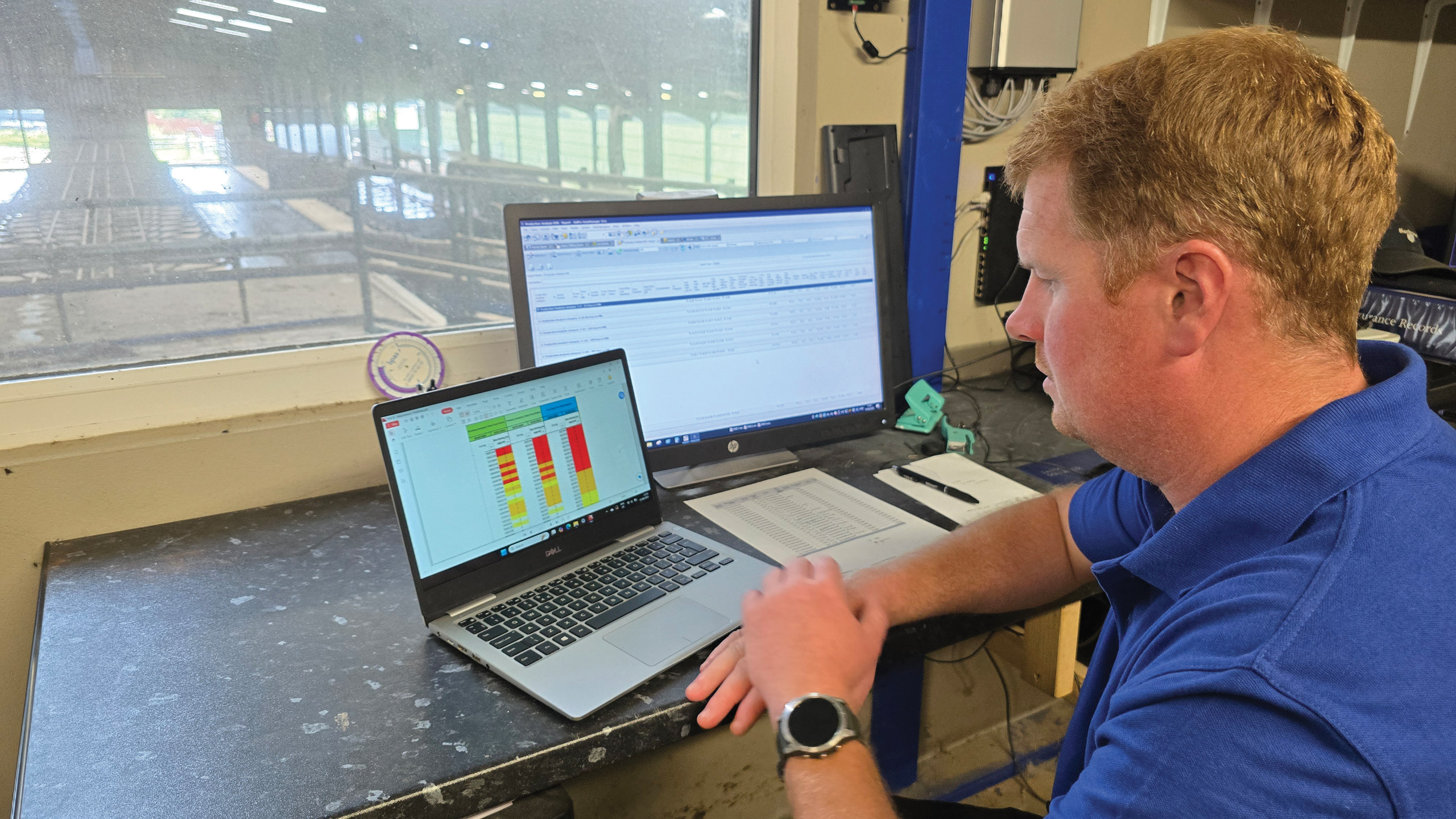 Farmer looking at computer screens