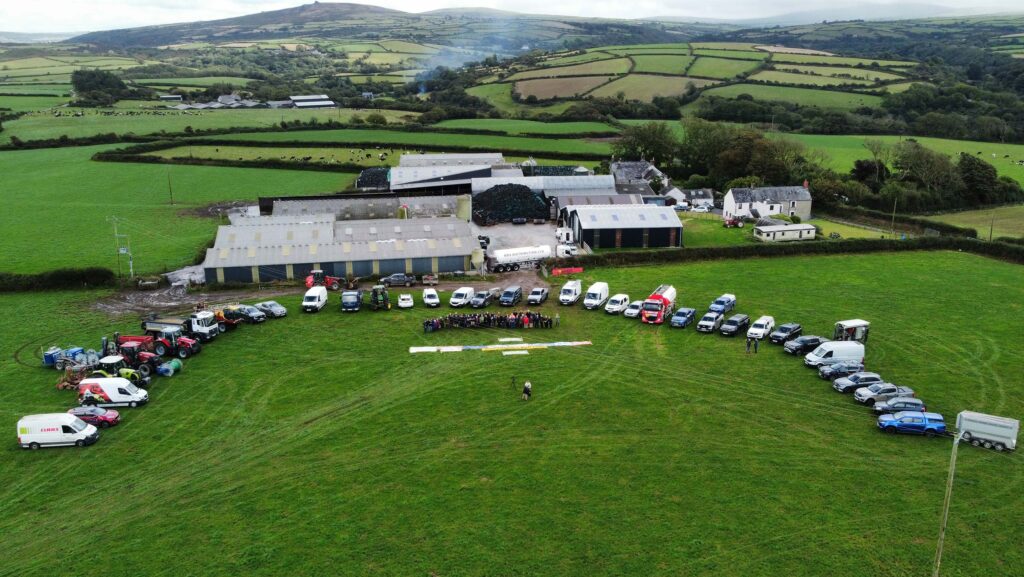 Aerial drone shot of vehicles on the farm