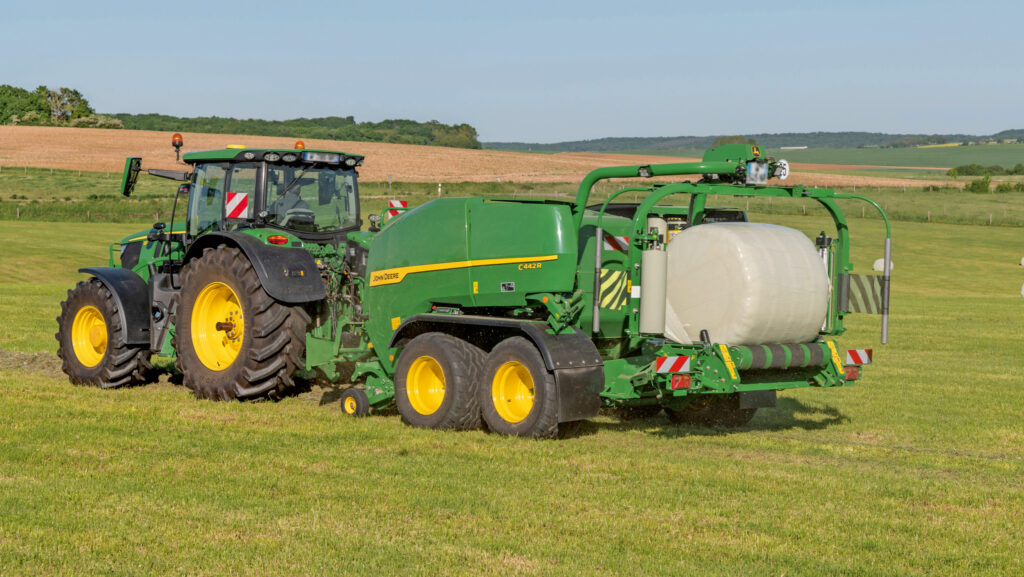 Baler ejecting plastic-wrapped bale